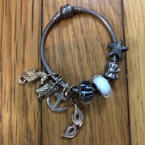 Pandora bracelet with 8 charms. For small wrist